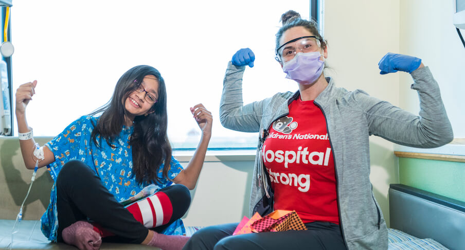A doctor speaks to a patient waiting in an MRI machine.