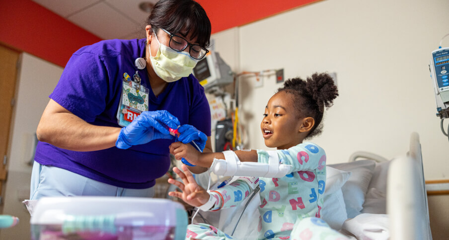 A doctor speaks to a patient waiting in an MRI machine.